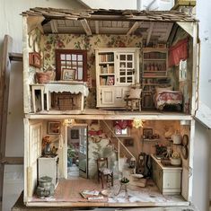 an old doll house with furniture and accessories