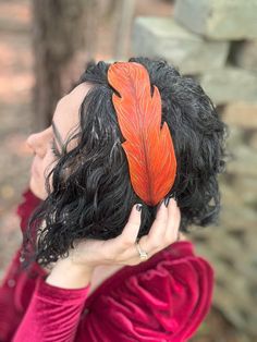 These one of a kind leather feather hairbands are all individually painted. With multiple styles and colors to choose from, adding a pop of color to any hairstyle is easy! The head bands can be easily secured by tying the adjustable leather cord.  DETAILS: -veg tan full grain leather -individually painted -leather cord and sliding charm Elegant Feathered Headband For Summer, Fitted Feather Headband, Leather Leaf Headband, Adjustable Feather Headband, Red Feathered Summer Headpiece, Leather Headband, Leather Headbands, Feather Headband, Head Bands