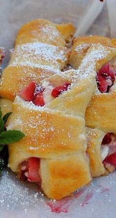 strawberry pastries with powdered sugar and fresh strawberries