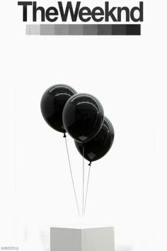 three black balloons floating in the air on top of a white pedestal with text that reads, the weeknd