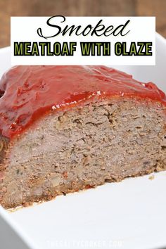 a loaf of meatloaf with glaze is on a white plate and has the words smoked meatloaf with glaze