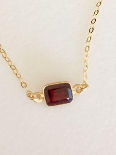 Lovely burgundy red natural garnet gemstone set in 24k gold vermeil bezel. Pendant is 6 x 8 mm and suspended from delicate sparkling 14k gold fill cable chain with matching spring ring clasp. Available in several lengths. Beautiful minimalist necklace makes lovely gift for a January birthday or Valentine sweetheart! Dainty Necklace Gold, Red Sea Glass, Star Garnet, January Birthday, Lapis Necklace, Beach Earrings, Sea Glass Earrings, Garnet Necklace, Garnet Jewelry