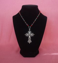 Large gothic cross pendant with a rosary-style chain featuring red Czech beads and others. Perfect for simple gothic styles or to layer with other pieces. Gothic Beaded Cross Jewelry, Red Crucifix Cross Necklace Gift, Red Crucifix Cross Necklace For Gift, Handmade Red Cross Pendant Jewelry, Handmade Red Crucifix Jewelry, Gothic Cross Necklaces For Jewelry Making, Handmade Red Cross Jewelry, Handmade Gothic Cross Pendant Necklace, Red Gothic Cross Necklace