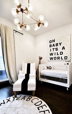 a baby's room with black and white decor