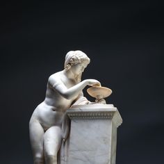 Marble sculpture, probably depicting an undressed nymph with curly hair and bracelets around her upper arms. She is leaning against a pillar and disturbing the surface of the water in the tazza with a staff. The effect of the ripples on the surface of the water has been wonderfully captured. The sculpture stands on a patinated wooden plinth with surrounding gold-patinated friezes. Anatomy Statue, Primitive Sculpture, Classic Sculpture Woman, Marble Sculpture Greek, Ancient Greek Sculpture Woman, Sculpture Greek, Female Marble Sculpture, Wooden Plinth, Pregnant Woman Sculpture