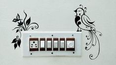 an electrical outlet with two birds on it