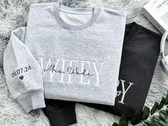 💍Celebrate your love story with a touch of elegance and personalization with our custom-embroidered sweatshirt. Handcrafted with care, this sweatshirt features a special message to commemorate the union of a bride and groom on their wedding day. 💍Made from 100% premium cotton, our sweatshirt offers unparalleled comfort and softness, perfect for those cozy moments. Each piece is meticulously crafted by skilled artisans who take pride in their workmanship, ensuring that every stitch reflects the Custom Text Crew Neck Top For Anniversary, Long Sleeve Cotton Sweatshirt For Anniversary, Customizable Cotton Tops For Anniversary, Crew Neck Cotton Top For Anniversary, Cotton Crew Neck Top For Anniversary, Wedding Sweatshirts, Wifey Sweatshirt, Cozy Moments, Embroidered Sweatshirt