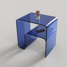 a blue glass table with a phone on it