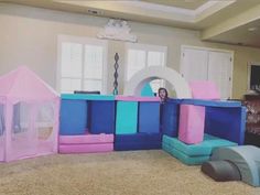 an inflatable play area with pink and blue walls