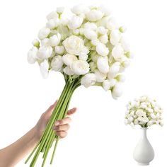 a hand holding a bouquet of white flowers next to a vase with baby's breath