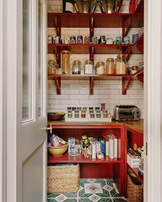 an open pantry with lots of food on the shelves