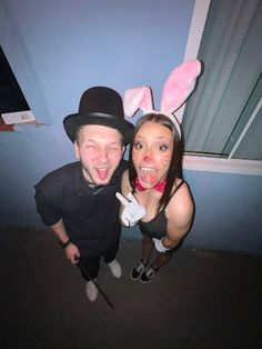 two people in bunny ears pose for a photo