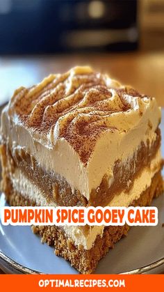 a piece of pumpkin spice gooey cake on a plate with the words, pumpkin spice gooey cake