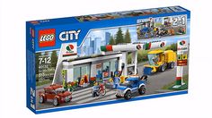 a lego city gas station with cars, motorcycles and people on the street in front of it