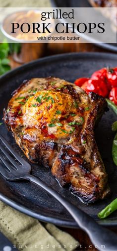 grilled pork chops with chipotie butter on a plate next to green beans and peppers