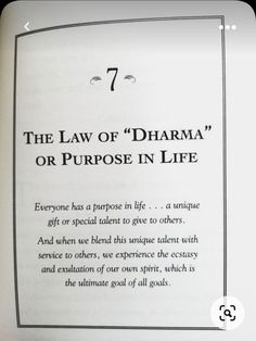 the law of dharma or purpose in life is written on an open book