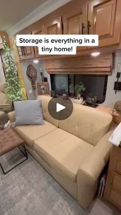 a living room filled with furniture and a fire place in the middle of a kitchen