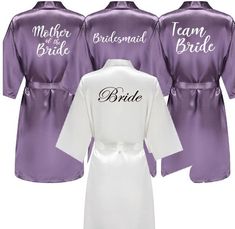 three bridesmaid robes in purple and white with the word'mother of the bride'on them