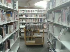 a library filled with lots of books and shelves