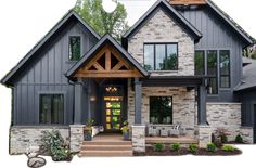 a large gray house with stone and wood accents