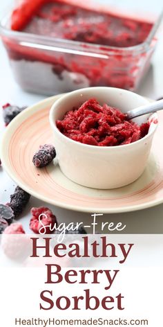 a white bowl filled with red berry sorbet on top of a plate