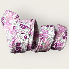 Treat yourself with a new pattern and splash of color to your look with this unique tie. 100% Cotton Handmade Package Includes: Slim Tie & Pocket Square Length: 57" Width: 2.6" Warm iron if needed Adjustable Standard Tie For Summer, Adjustable Multicolor Neckwear For Gift, Summer Neckwear As Gift, Pink Floral Print Ties For Spring, Floral Print Adjustable Tie, Adjustable Multicolor Standard Tie, Pink Floral Print Ties For Summer, Pink Floral Print Summer Ties, Pink Floral Print Tie For Summer