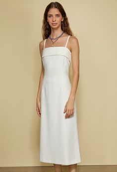 The Sol Dress in white is a cotton suiting spaghetti strap midi-length dress featuring overlay detail at the bust and a vent at the back. Fit: True to Size. Model wears size small. Sizing: XXS-XL Materials: 75% Polyester, 25% Rayon Ciao Lucia, White Evening Dress, Instagram Dress, Satin Evening Dresses, White Midi, City Dress, Dress Satin, Everyday Dresses, White Midi Dress