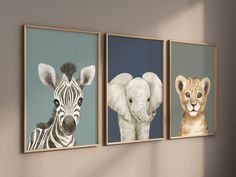 three pictures of animals hanging on the wall