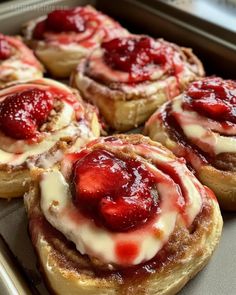 some very tasty looking pastries with strawberries on them