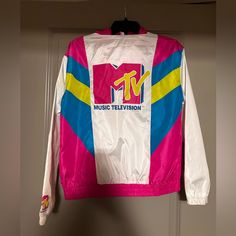 Never Worn Mtv Windbreaker, In Excellent Condition. No Holes Or Stains Size Small White Graphic Print Windbreaker For Streetwear, Sporty White Track Jacket With Letter Print, White Letter Print Track Jacket For Streetwear, White Track Jacket With Letter Print For Streetwear, Retro White Outerwear With Letter Print, White Casual Windbreaker With Graphic Print, Casual White Windbreaker With Graphic Print, White 90s Track Jacket With Long Sleeves, 90s Style White Long Sleeve Track Jacket