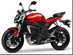 a red and black motorcycle is shown on a white background