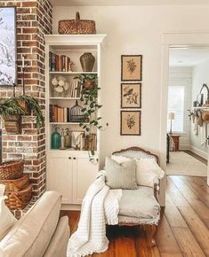 a living room filled with furniture and lots of bookshelves on top of it