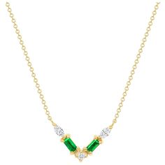 Crafted in 14K gold, this necklace features a thoughtfully arranged collection of emeralds and diamond pavé, elegantly set along a V-shaped plane. Crafted in 14K yellow gold, it exudes delicacy and emotion, showcasing a captivating color palette. Ideal for layering or making a statement on its own. Key Points: Gold Weight: 2.3 gr Diamond Weight: 0.18 ct Emerald: 0.23 ct Available in 14K white, yellow, and rose gold This Item was designed, made, and stamped in Los Angeles. Luxury Gold Baguette Cut Emerald Necklace, Elegant Green Baguette-cut Emerald Necklace, Luxury Yellow Gold Pear-shaped Emerald Necklace, Luxury Faceted Yellow Gold Emerald Necklace, Luxury Drop-shaped Emerald Necklace, V Shape, Pave Diamonds, Emerald, Color Palette