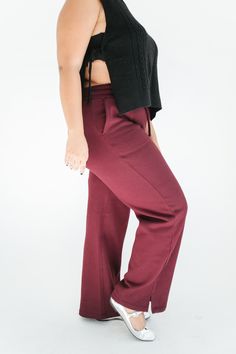 STYLE + FIT NOTES: Take your loungewear collection to the next level with the Sweet Escape Lounge Pant! Wide leg silhouette + gorgeous burgundy color is sure to make a statement - with minimal effort required! Pair with a bodysuit + jacket to elevate the look! Run true to size but we recommend sizing up if you want a more relaxed fit. High-waisted Viscose Loungewear Pants, Burgundy Casual Loungewear Bottoms, Non-stretch High Waist Burgundy Pants, The Sweet Escape, Red Moisture-wicking Yoga Pants, Red Compressive Moisture-wicking Yoga Pants, Sweet Escape, Burgundy Color, Lounge Pants