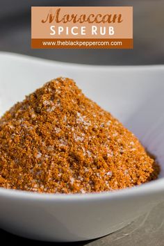 a white bowl filled with spices on top of a table