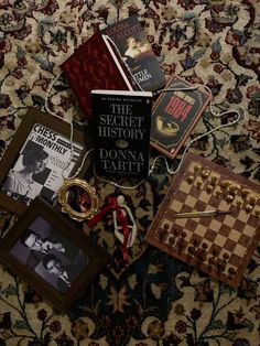 several books and other items on a carpet