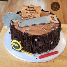 a birthday cake that is decorated with chocolate icing