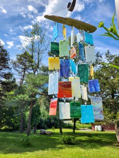 a wind chime made out of stained glass blocks