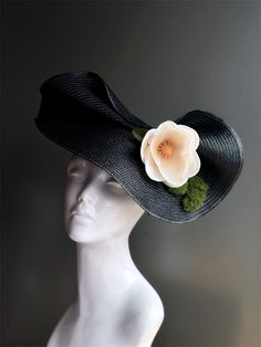 Black fascinator hat with a magnolia flower and green moss, perfect for tea parties, galas, or other elegant events!  I N C L U D E D Headband S H I P P I N G -  Processed same day or within 24 hours.  1-2 day guaranteed delivery, add item to cart, click shipping tab for rates.  Pls leave a check out note with your need date & contact number  Msg for delivery time frames (Include your state/country) S I Z E  Adult size. Dimensions available upon request.  C U S T O M I Z A T I O N If you would l Spring Formal Fascinator With Handmade Flowers, Spring Flower Fascinator For Formal Occasions, Spring Formal Flower Fascinator, Wide Brim Costume Hat For Formal Spring Events, Elegant Evening Mini Hats With Handmade Flowers, Spring Formal Mini Hat With Handmade Flowers, Spring Formal Flower-shaped Fascinator, Formal Wide Brim Costume Hat For Spring, Evening Fascinator With Handmade Flowers And Curved Brim