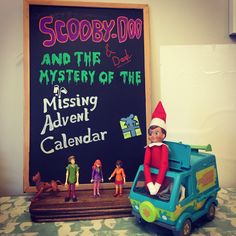 an elf is sitting on top of a toy car next to a chalkboard with the words scooby - do and the mystery of the missing advent calendar