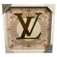 the louis vutton logo is displayed in a white box with gold trimmings