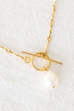 Dainty 14k gold filled necklace with a 8-9mm freshwater pearl and a toggle clasp Please note that each freshwater pearl is unique in shape and size so it will not look exactly like the one in the photos. Not all pearls are perfect and some may have dips/divots. Length: 18" If you would like a different length, please contact us for a custom order! Toggle Clasp Necklace, Knot Necklace, Toggle Clasp, Freshwater Pearls, Gold Filled, Style Inspiration, Gold