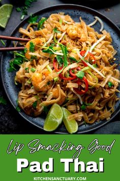 pad thai noodles on a plate with chopsticks and cilantro garnish