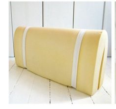 two pictures of the same yellow pillow with white stripes on each side, and one showing it's back end