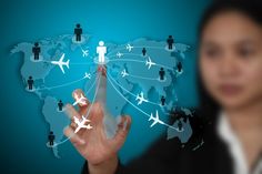 a person touching an airplane map with many planes flying over it and the earth in the background