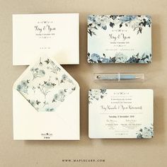 the wedding stationery is laid out on top of each other