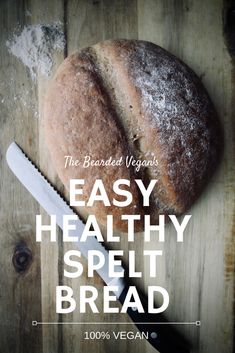 a loaf of bread sitting on top of a wooden cutting board next to a knife