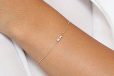 "Baguette Diamond Bracelet in 14k Solid Gold / Dainty Diamond Bracelet / Minimal Diamond Bracelet / Baguette Diamond / Black Friday Made to Order. * Gold Kt: 14K Solid Gold * Custom Gold Color: Rose Gold, Yellow Gold, White Gold * Baguette Diamond: 2 pcs 3 x 1.5 * Total Number of Stones: 2 * Total CTW: 0.12 Ctw * Diamond Color Clarity: G Color VS Clarity * Setting Type: Prong * Ready to Ship in 7-10 Business Days If you have any additional questions about this ring, just hit the \"Ask a Question Fine Jewelry Baguette Bracelet For Wedding, Delicate Baguette Cut Jewelry For Formal Occasion, Delicate Baguette Cut Formal Jewelry, Elegant 14k Gold Bracelet With Baguette Diamonds, Elegant 14k Gold Bracelets With Baguette Diamonds, Delicate Formal Jewelry With Baguette Diamonds, 14k Gold Diamond Bracelet With Baguette Diamonds For Anniversary, Classic Baguette Diamond Bracelet For Gifts, Classic Baguette Diamond Bracelet Gift