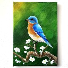 a painting of a blue bird on a branch with white flowers