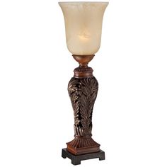 a lamp that is sitting on top of a wooden stand with a white glass shade